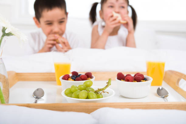 Kids eating in bedroom