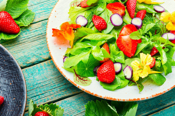 Fresh vegan salad of green ripe strawberries.Summer vitamin salad.