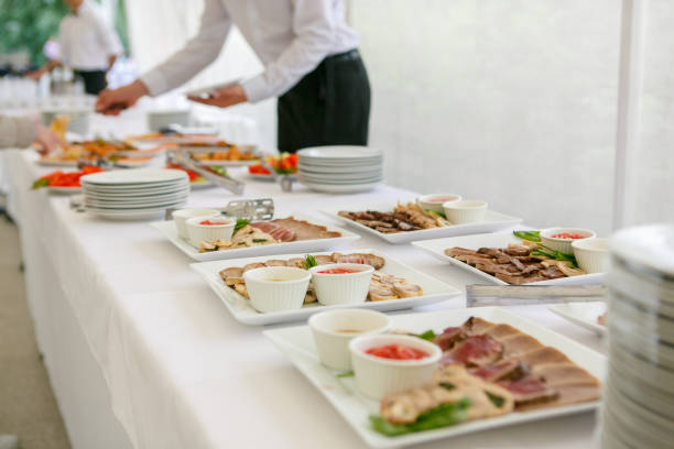 A dishes with meat assorted and sauces are served on the banquet table