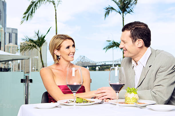 Beautiful couple enjoying dinner outdoors.