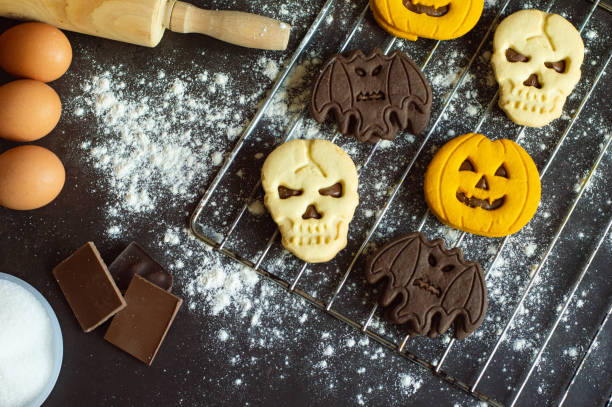 Delicious fresh cookies on kitchen background with ingredients.